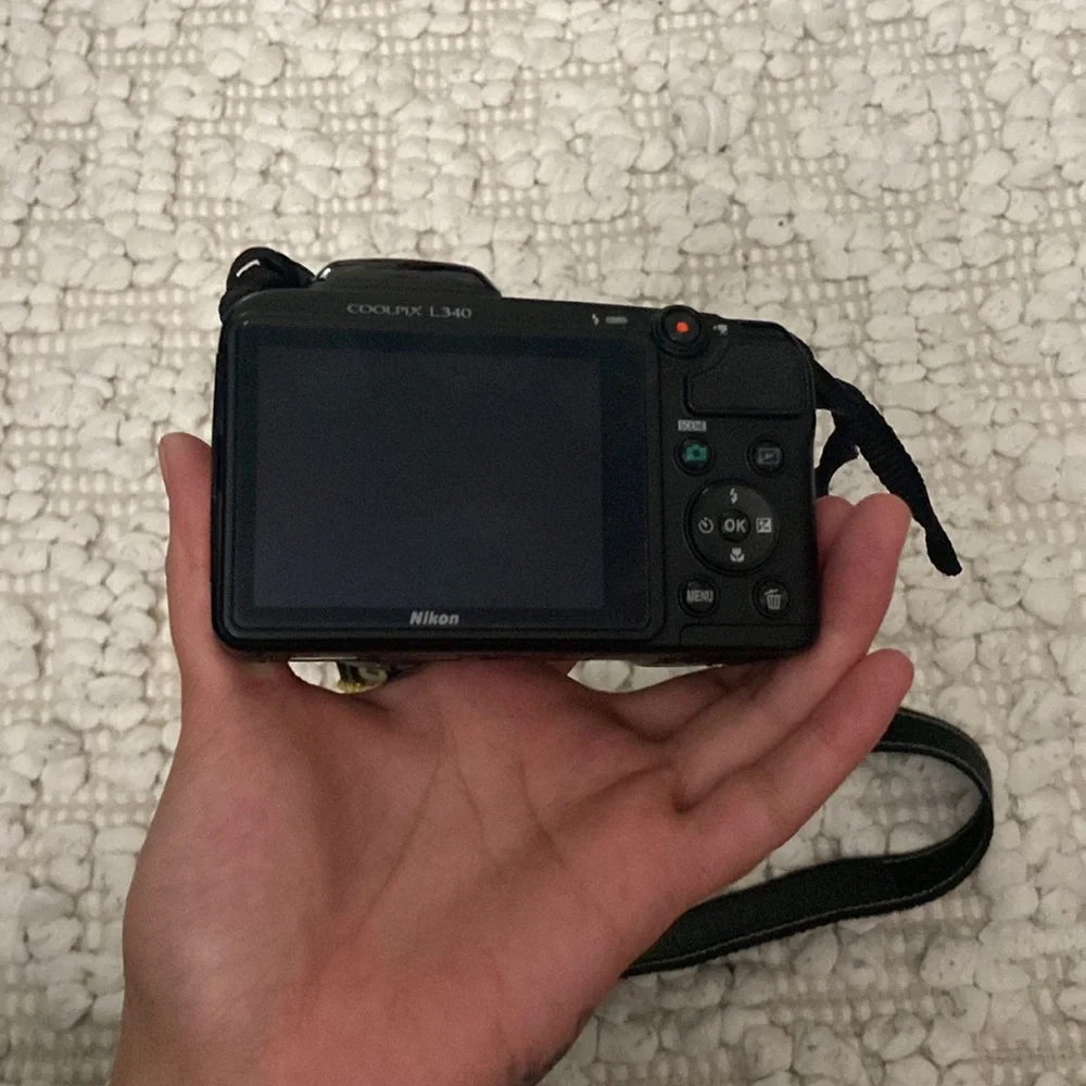 Black Nikon coolpix digital camera